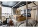 Bedroom featuring metal four poster bed and sitting area at 1421 Peachtree Ne St # 203, Atlanta, GA 30309