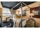 Stylish bedroom featuring a four-poster bed, black ceiling, and elegant decor for a luxurious and cozy retreat at 1421 Peachtree Ne St # 203, Atlanta, GA 30309