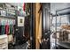 Spacious closet with clothing and shelving leading to a bedroom with a canopy bed and outside view at 1421 Peachtree Ne St # 203, Atlanta, GA 30309