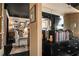 Hallway featuring dark floors, and an entry to a stylish room with decor, art and a black ceiling at 1421 Peachtree Ne St # 203, Atlanta, GA 30309