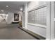 Hallway view of mailboxes and an adjacent seating area with modern artwork at 1421 Peachtree Ne St # 203, Atlanta, GA 30309