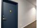 Hallway leads to unit door #203, with neutral paint, wall outlet and carpeted floor at 1421 Peachtree Ne St # 203, Atlanta, GA 30309