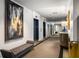 Hallway featuring seating, a painting, and elevator access, all complemented by carpet flooring at 1421 Peachtree Ne St # 203, Atlanta, GA 30309