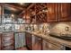 Kitchenette view with granite countertops, stainless steel appliances, and dark wood cabinetry at 1421 Peachtree Ne St # 203, Atlanta, GA 30309