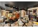 Inviting living room with dark hardwood floors, mirrored wall, and a glimpse of the bar area at 1421 Peachtree Ne St # 203, Atlanta, GA 30309