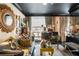 Cozy living room with lots of artwork, books, and stylish furniture at 1421 Peachtree Ne St # 203, Atlanta, GA 30309