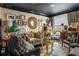 Living room with dark trim, lots of artwork, stylish furniture, and plenty of light at 1421 Peachtree Ne St # 203, Atlanta, GA 30309