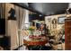 Cozy dining room with a round table, curated decor, and natural light from large windows at 1421 Peachtree Ne St # 203, Atlanta, GA 30309