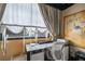 Stylish office space features a unique window treatment and an elegant marble desktop and modern chair at 1421 Peachtree Ne St # 203, Atlanta, GA 30309