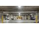 Brightly lit parking garage with assigned parking spots at 1421 Peachtree Ne St # 203, Atlanta, GA 30309