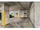 Underground parking garage with reserved parking spaces and cement walls at 1421 Peachtree Ne St # 203, Atlanta, GA 30309