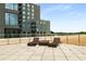 Relaxing rooftop deck with lounge chairs and city views at 1421 Peachtree Ne St # 203, Atlanta, GA 30309