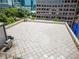 Wide angle rooftop view featuring multiple seating arrangements, a grill, and a dining area at 1421 Peachtree Ne St # 203, Atlanta, GA 30309