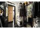 Spacious walk-in closet with custom storage, convenient layout, and access to the bathroom at 1421 Peachtree Ne St # 203, Atlanta, GA 30309