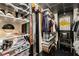 Well-organized walk-in closet featuring custom shelves, hanging racks, and ample storage solutions at 1421 Peachtree Ne St # 203, Atlanta, GA 30309