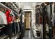Expansive walk-in closet with custom shelving, hanging space, and easy access to other rooms at 1421 Peachtree Ne St # 203, Atlanta, GA 30309