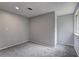 This is a bedroom with gray walls, carpet, and a closet at 1492 Harbins Rd, Norcross, GA 30093