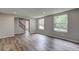 Bright living room featuring new flooring, freshly painted walls, and an abundance of natural light at 1492 Harbins Rd, Norcross, GA 30093