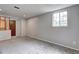 Finished room with carpet and a view out the window at 1492 Harbins Rd, Norcross, GA 30093