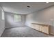 Neutral finished room with carpet, recessed lighting, and a cabinet against the wall at 1492 Harbins Rd, Norcross, GA 30093