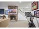 Basement featuring brick fireplace, shiplap walls, carpeted floors, and exercise equipment at 3251 Pinestream Nw Rd, Atlanta, GA 30327