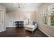 Bedroom featuring hardwood floors, shuttered windows, and neutral decor at 3251 Pinestream Nw Rd, Atlanta, GA 30327