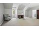 Spacious bedroom with vaulted ceilings, chair, desk and carpeted floors and lots of natural light at 3251 Pinestream Nw Rd, Atlanta, GA 30327