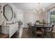Elegant dining room with a round table and stylish wallpaper at 3251 Pinestream Nw Rd, Atlanta, GA 30327