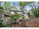 Exterior of house nestled in a mature, wooded lot at 3251 Pinestream Nw Rd, Atlanta, GA 30327