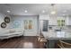 Bright kitchen features stainless appliances, granite counters, and an adjoining living area at 3251 Pinestream Nw Rd, Atlanta, GA 30327