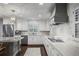 Lovely updated kitchen with granite countertops, stainless appliances, and ample cabinet space at 3251 Pinestream Nw Rd, Atlanta, GA 30327