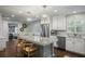 Bright kitchen features granite counters, stainless appliances, and a charming breakfast nook at 3251 Pinestream Nw Rd, Atlanta, GA 30327