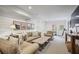 Spacious living room with shiplap walls, carpet and neutral furniture, with a view to the outdoors at 3251 Pinestream Nw Rd, Atlanta, GA 30327