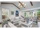 Inviting living room with vaulted ceiling, exposed beams, and lots of natural light at 3251 Pinestream Nw Rd, Atlanta, GA 30327