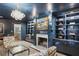 Cozy living room with a fireplace and built-in bookshelves at 3251 Pinestream Nw Rd, Atlanta, GA 30327