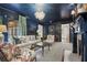 Stylish living room with dark blue walls and unique decor at 3251 Pinestream Nw Rd, Atlanta, GA 30327