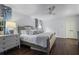 Bright main bedroom features hardwood floors, soft lighting, and ensuite bathroom at 3251 Pinestream Nw Rd, Atlanta, GA 30327