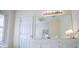 Bathroom with a large vanity, ample lighting, and a neutral color palette for a clean design at 111 Dixson Rd, Bowdon, GA 30108