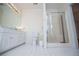 Well-lit bathroom with a glass-enclosed shower, toilet, vanity, and tiled floors for a fresh look at 111 Dixson Rd, Bowdon, GA 30108