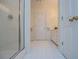 Bathroom with white tile flooring, walk-in shower, and white vanity at 111 Dixson Rd, Bowdon, GA 30108