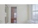Bright bathroom featuring a bathtub, shower, and window with shutter, offering natural light and relaxation at 111 Dixson Rd, Bowdon, GA 30108