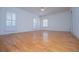 Spacious bedroom with wood flooring and large windows at 111 Dixson Rd, Bowdon, GA 30108