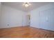 Bright bedroom features hardwood floors, neutral paint, and double door closet at 111 Dixson Rd, Bowdon, GA 30108