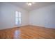 Spacious bedroom with hardwood floors, shutters, ceiling fan, and neutral paint at 111 Dixson Rd, Bowdon, GA 30108