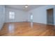 Bright bedroom with hardwood flooring, ceiling fan, and large windows at 111 Dixson Rd, Bowdon, GA 30108