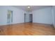 Bright bedroom with hardwood flooring, ceiling fan, and ensuite bathroom at 111 Dixson Rd, Bowdon, GA 30108