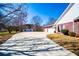 A long driveway leads to an attached two-car garage, plus a detached garage and storage building at 111 Dixson Rd, Bowdon, GA 30108