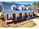 Charming red brick home with white shutters and a welcoming front porch at 111 Dixson Rd, Bowdon, GA 30108