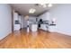 Spacious kitchen with white cabinetry, an island, hardwood floors and great natural light at 111 Dixson Rd, Bowdon, GA 30108