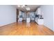 The kitchen features an island, hardwood floors and white cabinets at 111 Dixson Rd, Bowdon, GA 30108